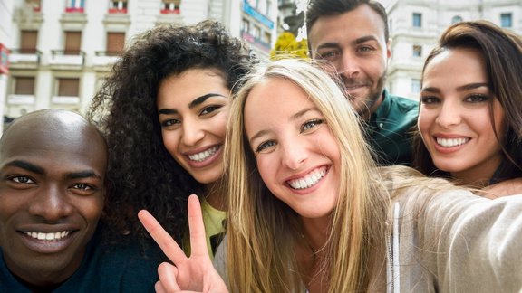 Multiracial group of young people taking selfie